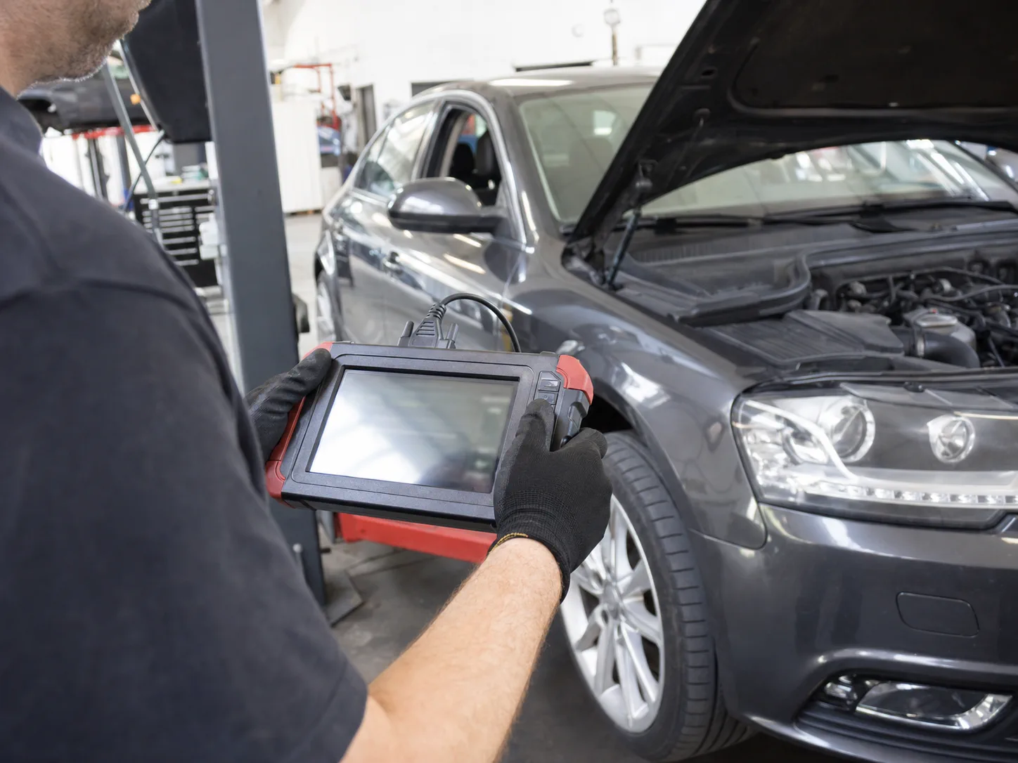 Technician reviewing vehicle diagnostic data with a scan tool
